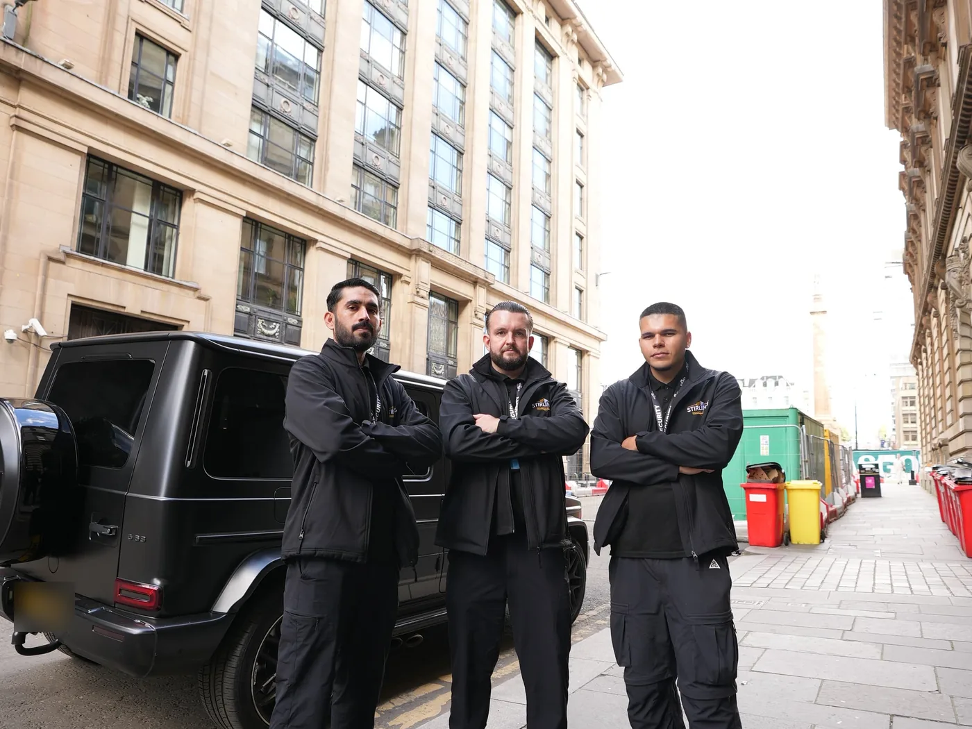 Stirling's Security officers with a company vehicle in Glasgow city centre